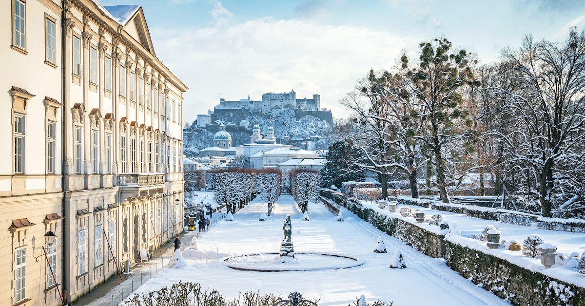 Snow-covered Mirabell Gardens with Hohensalzburg Fortress in the background