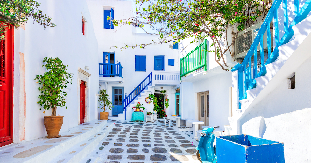 White-washed street of Mykonos with colorful doorways and window frames