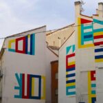 Colorful lines painted on the side of a building in Las Letras, Madrid