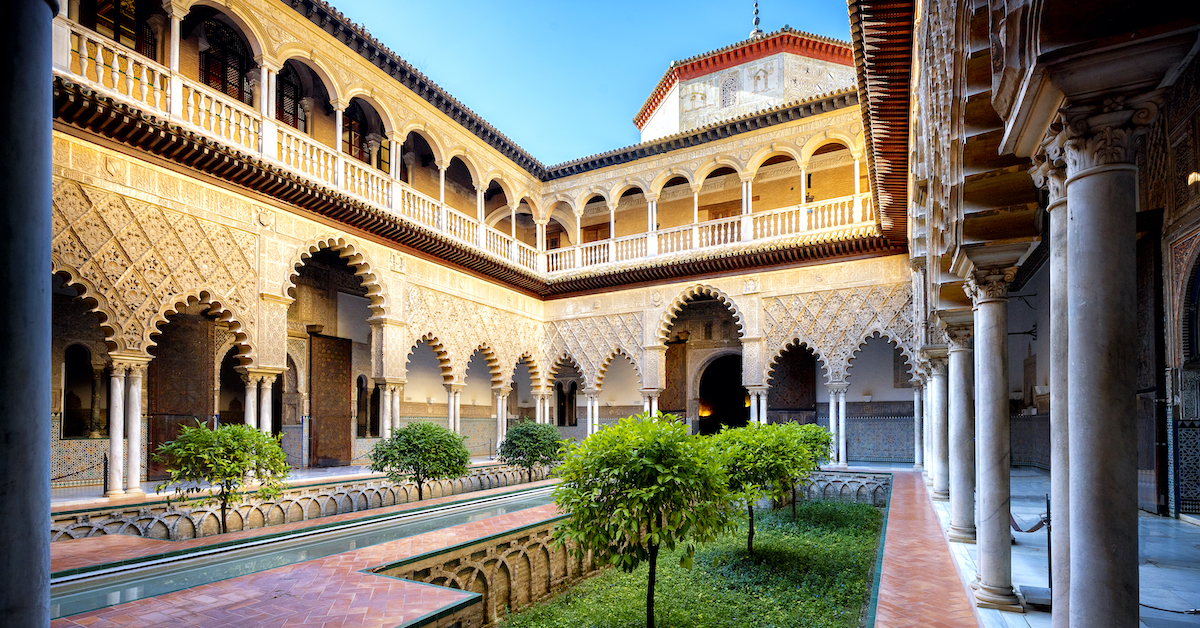 Moorish archways lining the courtyard of Seville's Real Alcazar