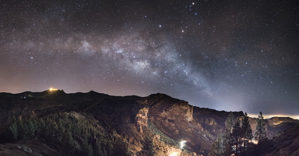 Night sky of an abundance of stars and the Milky Way over a valley in Spain’s Canary Islands, one of the best spots for stargazing in Europe