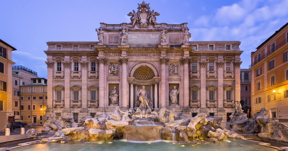 Trevi Fountain lit up at sunset in Rome, one of the most popular Italy honeymoon destinations