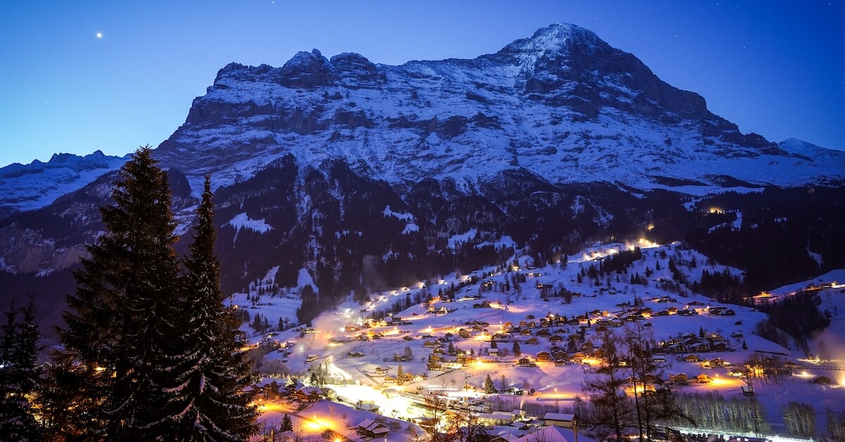 Snow-covered town of Grindelwald in Switzerlands Bernese Oberland, an ideal spot for winter vacations