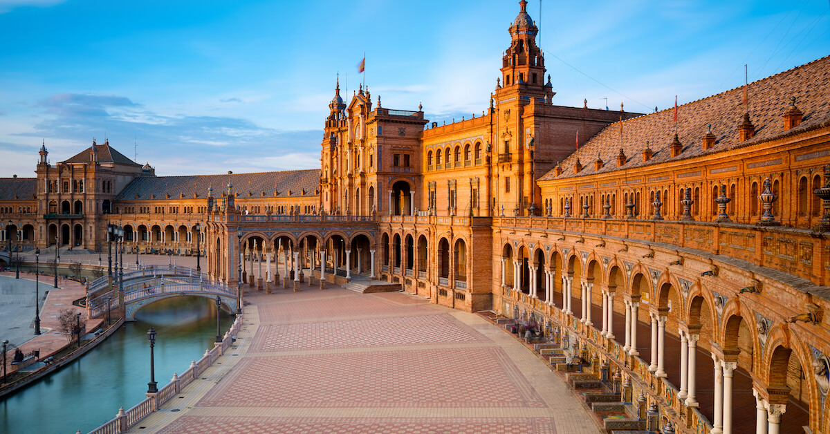 Moorish-style building lined with arches in Plaza de España in Seville, Spain