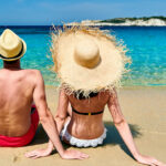 A couple sitting on a beach