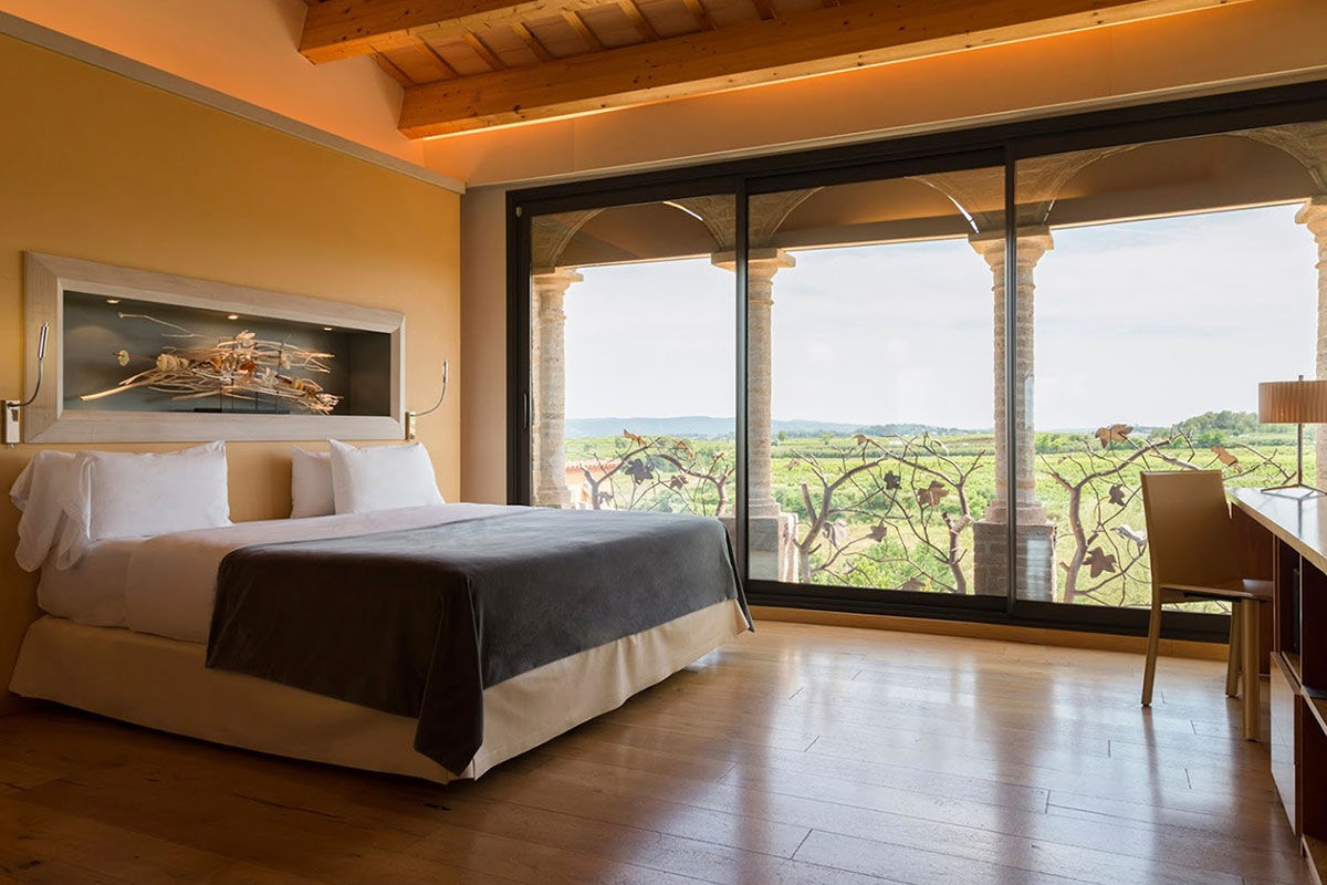 <b>Can Bonastre Wine Resort, Masquefa</b> - Boasting over 460 years of wine history and set in a 16th century farmhouse, the Can Bonastre Wine Resort sits below the Monteserrat mountain range and is surrounded by vineyards. Wander from your polished room, head past the chic spa and sauna, meander through the landscaped gardens, and arrive just in time for your wine tasting tour.