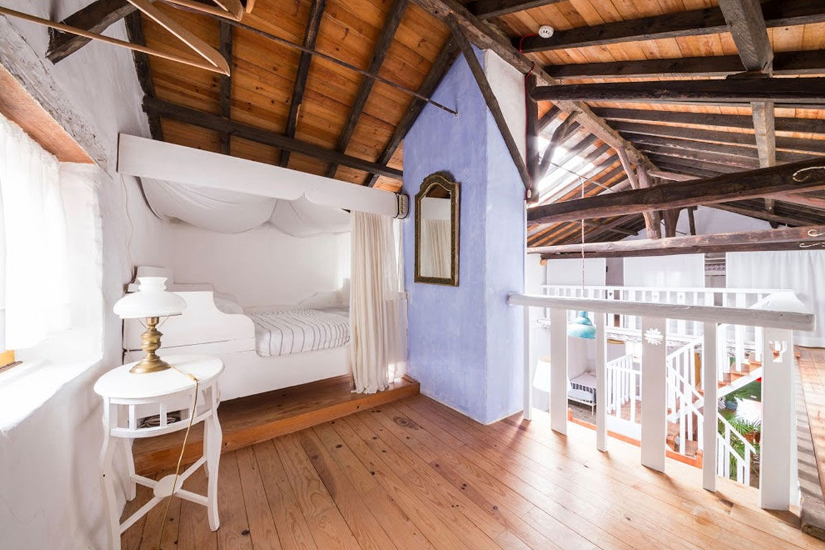 <b>Casa Paco D’Ilhas, Ericeira</b> - With heritage styling and a bright, colorful palette, the Casa Paco D’Ilhas immerses guests in a holistic leisure approach to life. With cabanas overgrown with tropical plants, a white stone pool, and décor with a rustic edge, this quaint hotel provides guests with an authentic experience - the perfect ocean getaway.