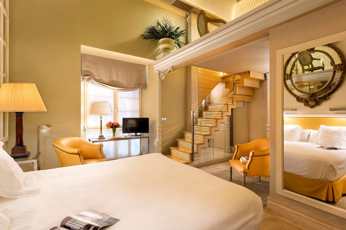 <b>Boutique Hotel Casa del Poeta</b> - With a warm orange courtyard, full of lush greenery, this historic mansion is a 3-minute walk to the Seville Cathedral and a 7-minute walk to the Alcazar of Seville. Rooms are classically elegant and the fountain in the center of the courtyard is guests’ favorite detail.