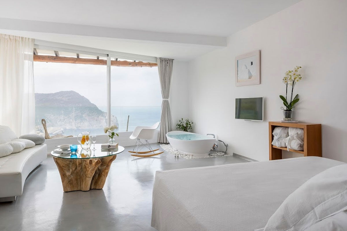 <b>Hacienda Na Xamena, Ibiza</b> - Removed from the clubbing areas of the island, Hacienda Na Xamena is an oasis to rejuvenate your body and overall well-being. The rooms are airy with incredible views, the restaurant and bar have lush plants throughout, and the combination of exposed wood and white-washed walls brings a feeling of freshness to your senses.