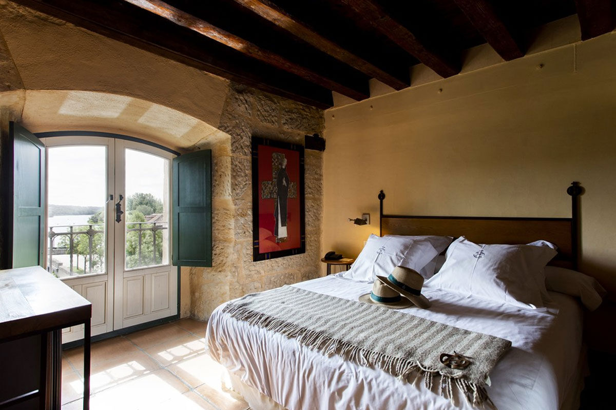 <b>Hacienda Zorita, Salamanca</b> - What once was an ancient Dominican monastery of the 14th century, Hacienda Zorita is a wine hotel and organic farm located on the River Tormes and is surrounded by countryside and vineyards. Taste the small batch wines, savor local cuisine, and admire the exposed wooden beams, stone walls, and almost-Tuscan finishes.