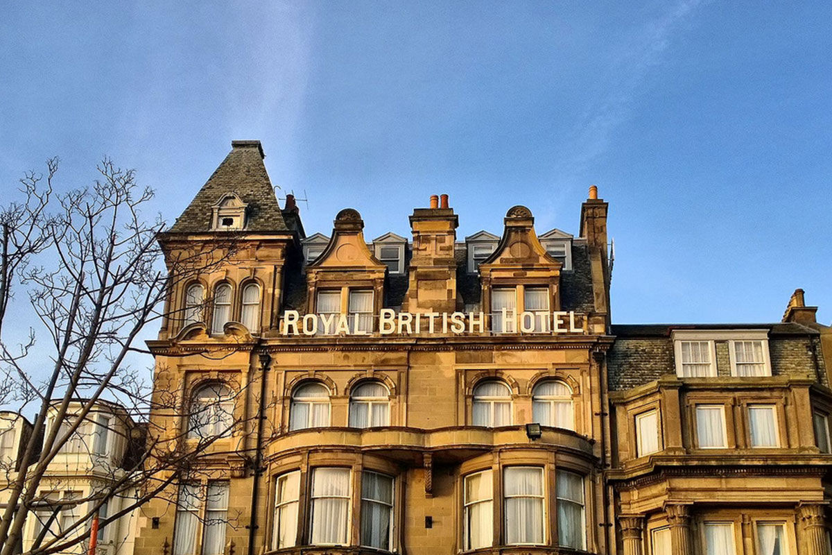 <b>Hotel Indigo Princes Street</b> - Close to museums and castles, this genteel hotel features dark wood, leather and aged photographs throughout, making you feel like you stepped into a moody upscale pub for a delicate cocktail. With tufted furnishings and modern touches, the Hotel Indigo Princes Street is the perfect match of traditional period pieces and contemporary details.