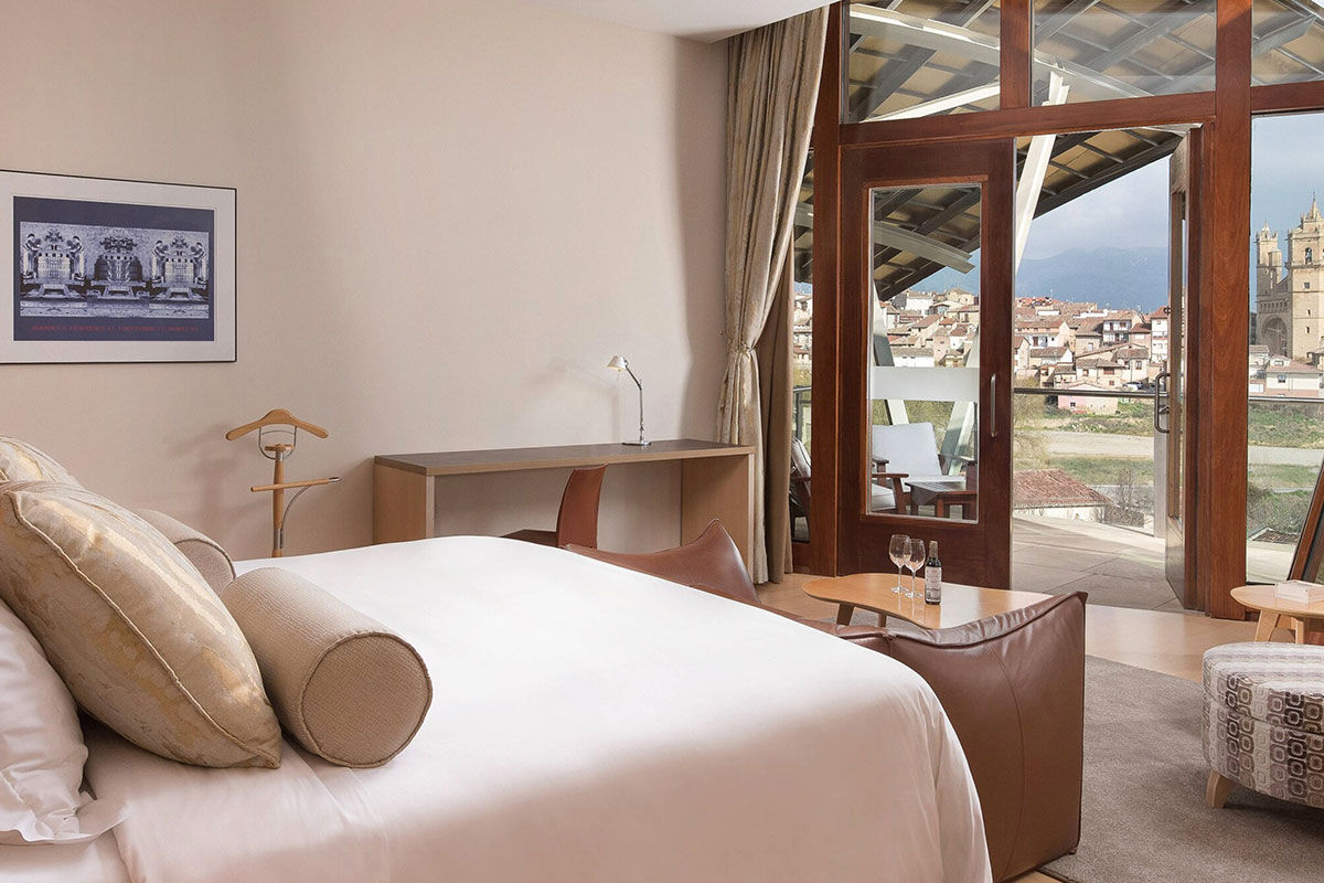 <b>Hotel Marques de Riscal, Elciego</b> - Designed by architect Frank Gehry, the Hotel Marques de Riscal is a piece of artwork in and of itself and has incredible views over the vineyard. Nestled within the medieval village of Elciego, the spectacular curves, titanium roof and avant garde feel is surprising within the region, to say the least!