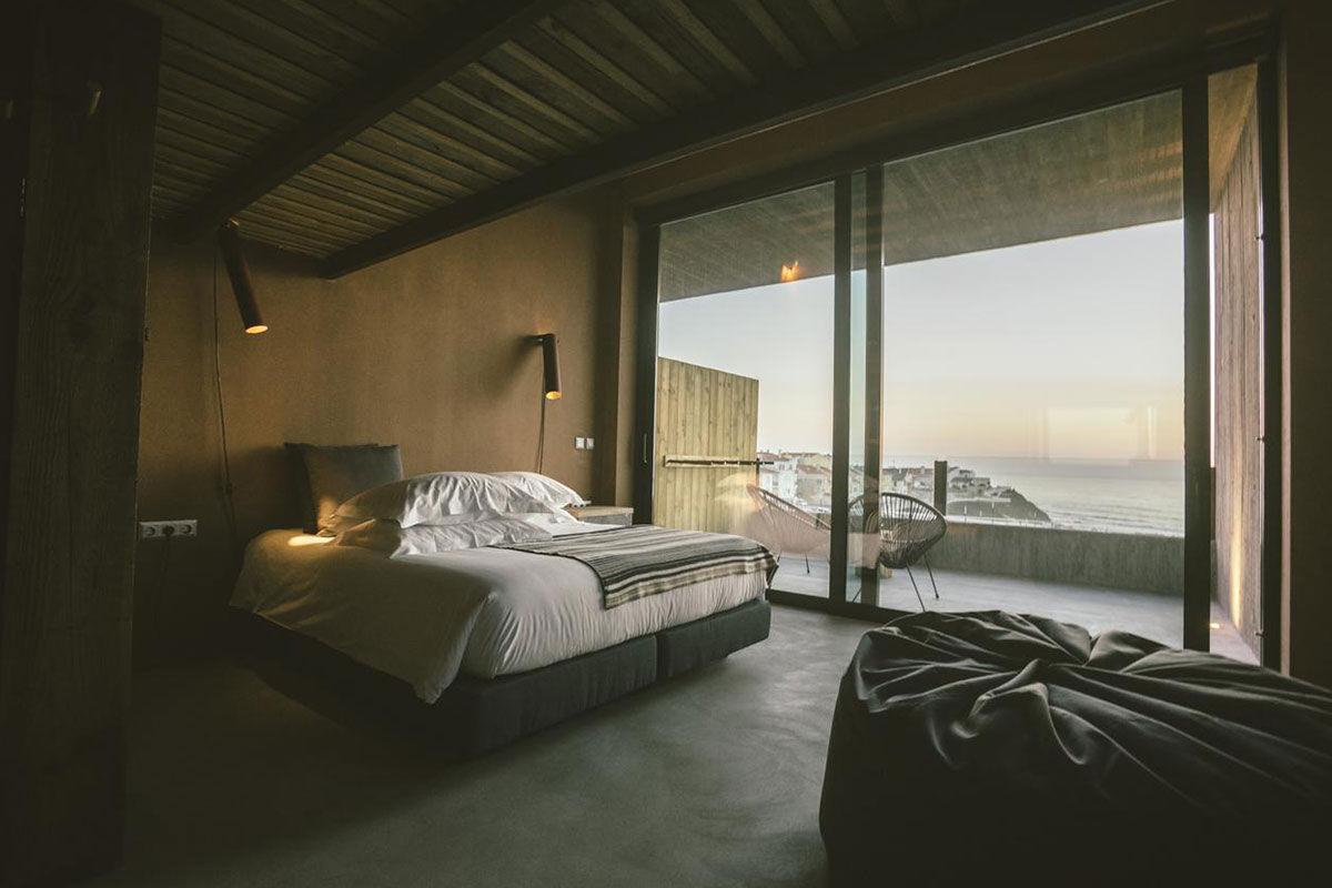 <b>Noah Surf House, A dos Cunhados</b> - Sitting on Praia da Fisica in Santa Cruz, this industrial-chic hotel lives in respect and consonance with nature. With its focus on the Atlantic Ocean, the Noah Surf House is a gathering place for travelers who love to surf, skateboard, adventure and appreciate a crackling fire with friends.