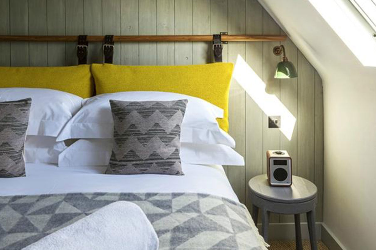 <b>The Old Stocks Inn, Stow-on-the-Wold</b> - This 17th century coaching inn set in Stow-on-the-Wold’s historic market square has been refurbished into a boutique hotel with character and charisma. There’s a historic pub with exposed oak beams and a log fireplace along with an English patio garden and vibrant detailing.