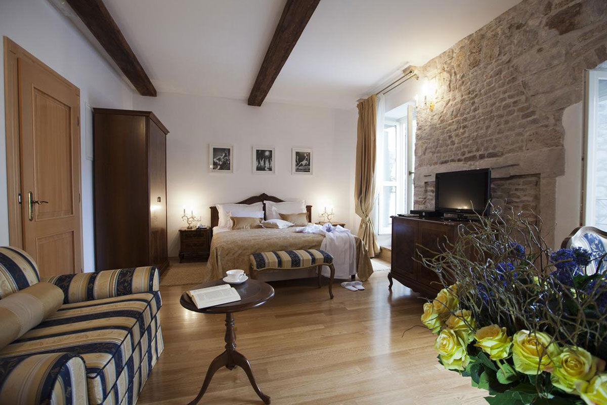 <b>Palace Judita Heritage Hotel</b> - Set on the lively 13th century Pjaca Square and housed in a 16th century palace, this boutique hotel has character and charm. The courtyard is home to lush plants and bistro tables, the restaurant is cozy with a fireplace and chandeliers, and the rooms feature wood floors, exposed beams and stone walls.