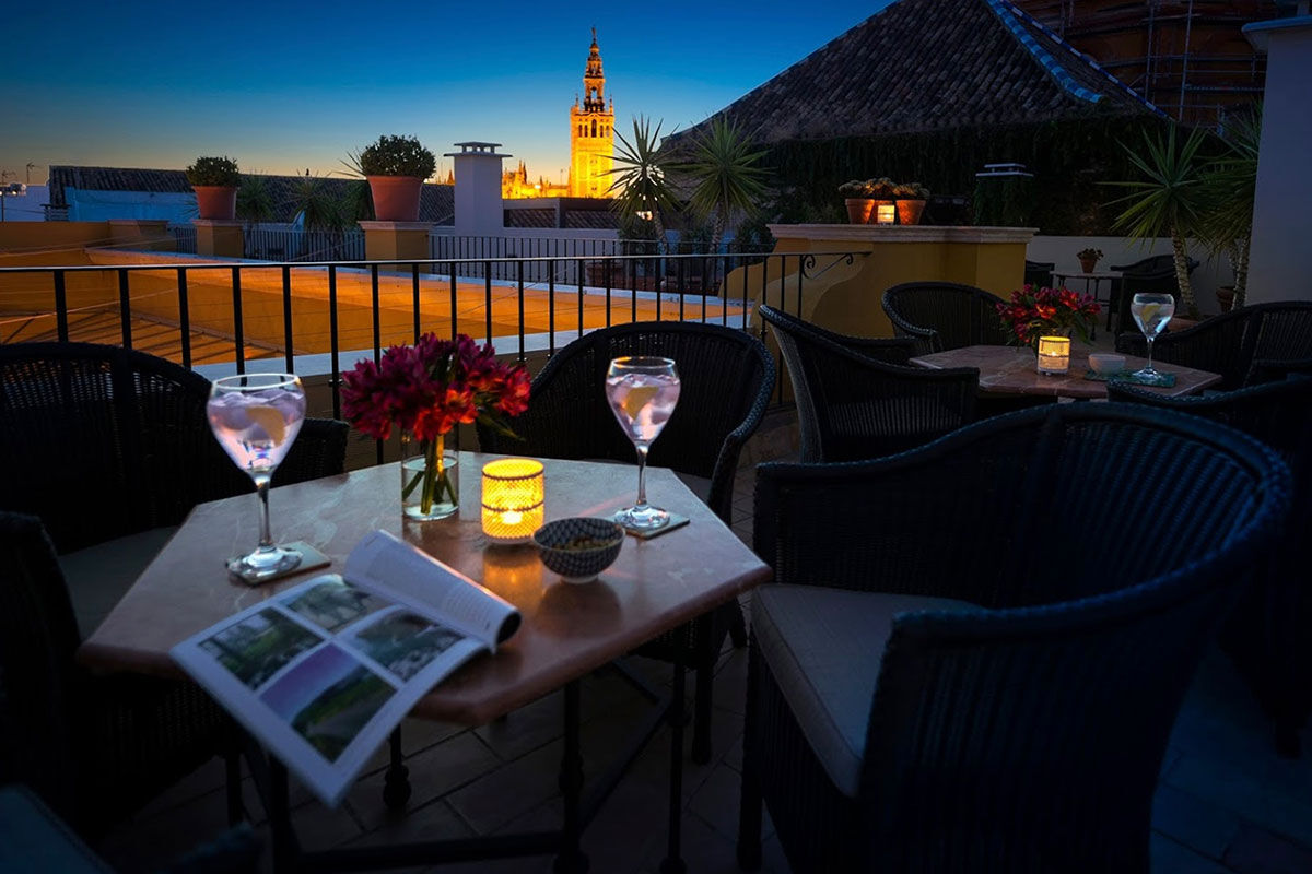 <b>Boutique Hotel Casa del Poeta</b> - With a warm orange courtyard, full of lush greenery, this historic mansion is a 3-minute walk to the Seville Cathedral and a 7-minute walk to the Alcazar of Seville. Rooms are classically elegant and the fountain in the center of the courtyard is guests’ favorite detail.