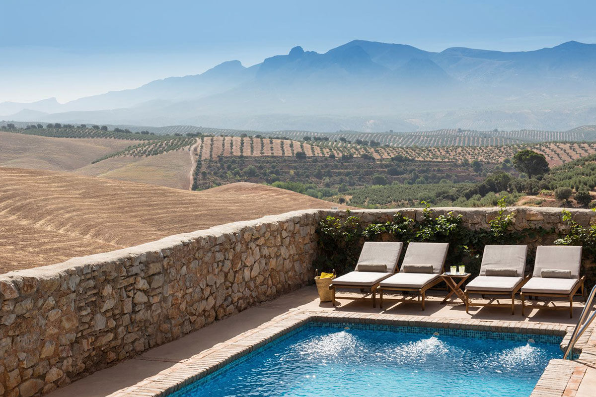 <b>Cortijo del Marqués, Granada</b> - This restored 19th century manor is now home to Coritjo del Marques, a stylish boutique hotel surrounded by olive trees and sunflower fields. Lounge by the pool and enjoy the mountain views and enjoy a candlelit dinner on the patio.