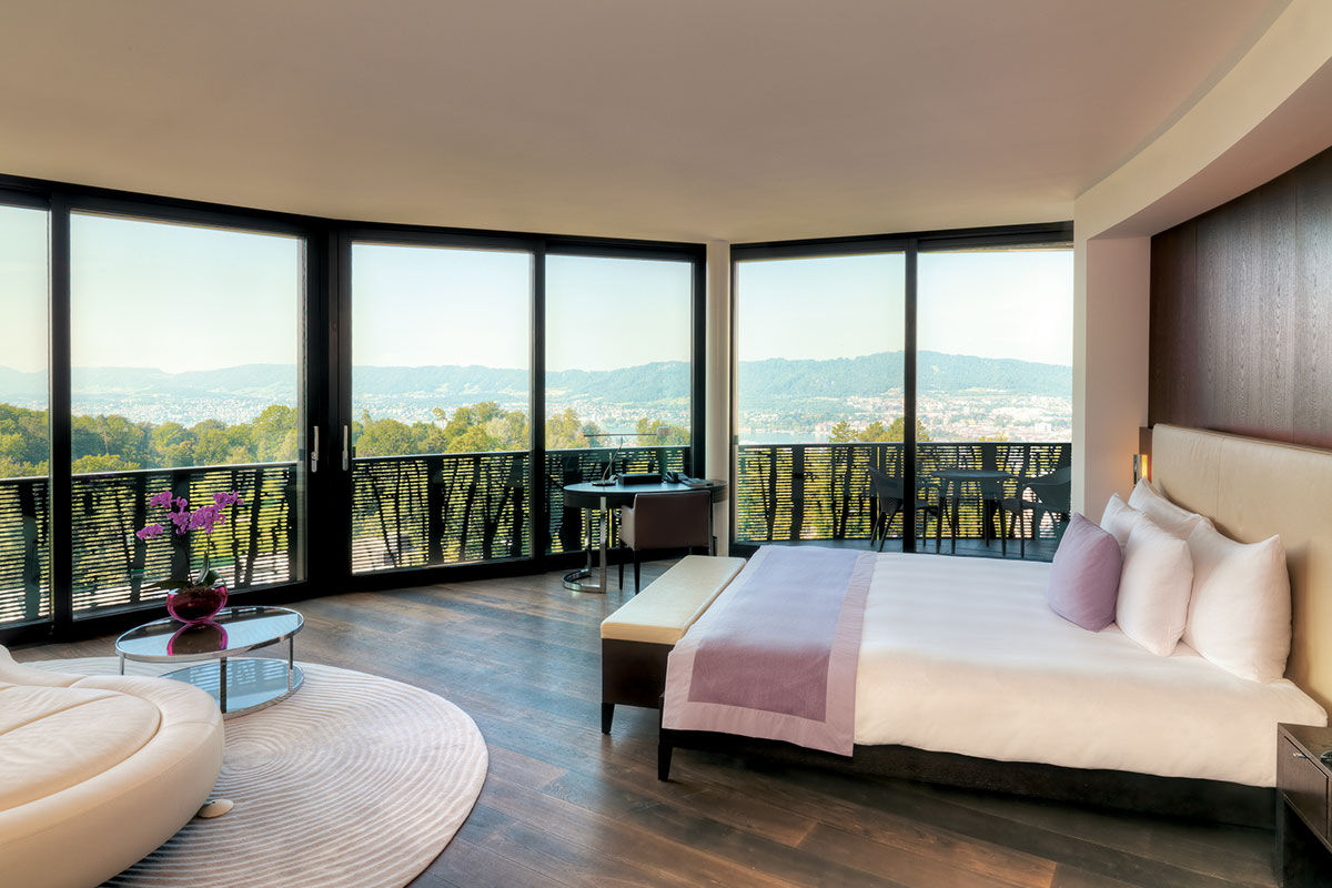 <b>The Dolder Grand</b> - A castle in the sky, this contemporary art hotel is housed in a stately building est.1899 and has views of the Alps and Lake Zurich. Enter this fairytale-like hotel and find a two Michelin starred restaurant, a comprehensive spa, panoramic pool, as well as a lounge/bar with live piano music.