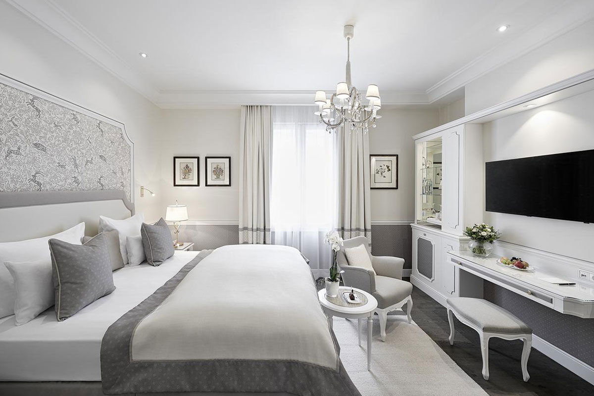 <b>Hotel Sacher</b> - Est. 1866 on the banks of the Salzach River, Hotel Sacher is a 5-minute walk to Salzburg’s old town and Schloss Mirabell Palace as well as a 10-minute walk to the Salzburger Dom Cathedral. Guests can dine at one of 3 restaurants, each with a different atmosphere and cuisine; the café, cocktail bar and chocolate shop tempt guests with their offerings; the plush rooms are designed with tradition in mind, featuring antiques and oil paintings throughout.