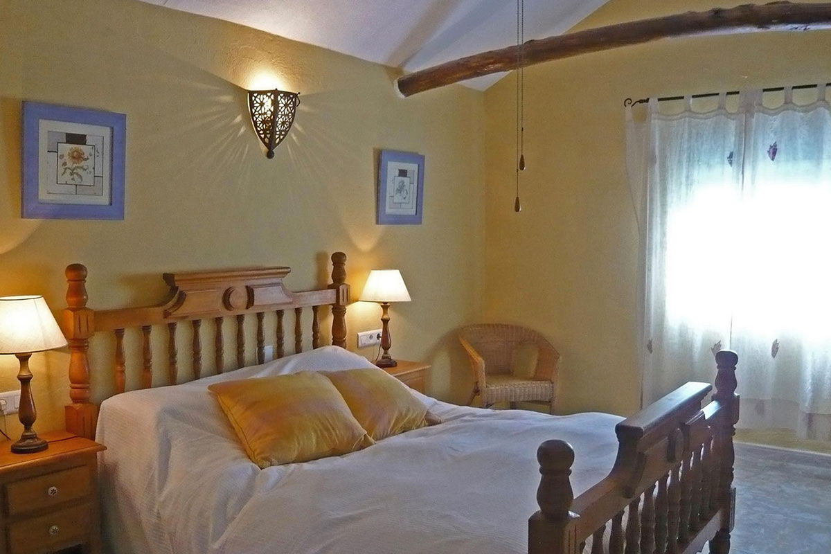 <b>El Molino del Conde, Malaga</b> - Located near the lovely Lake Iznajar, El Molino del Conde is a grand Andalucian mill house-turned holiday rental. Secluded by large gardens and surrounded by hills and olive groves, this charming white estate features a pool and multiple terraces where you can eat a leisurely dinner with family.