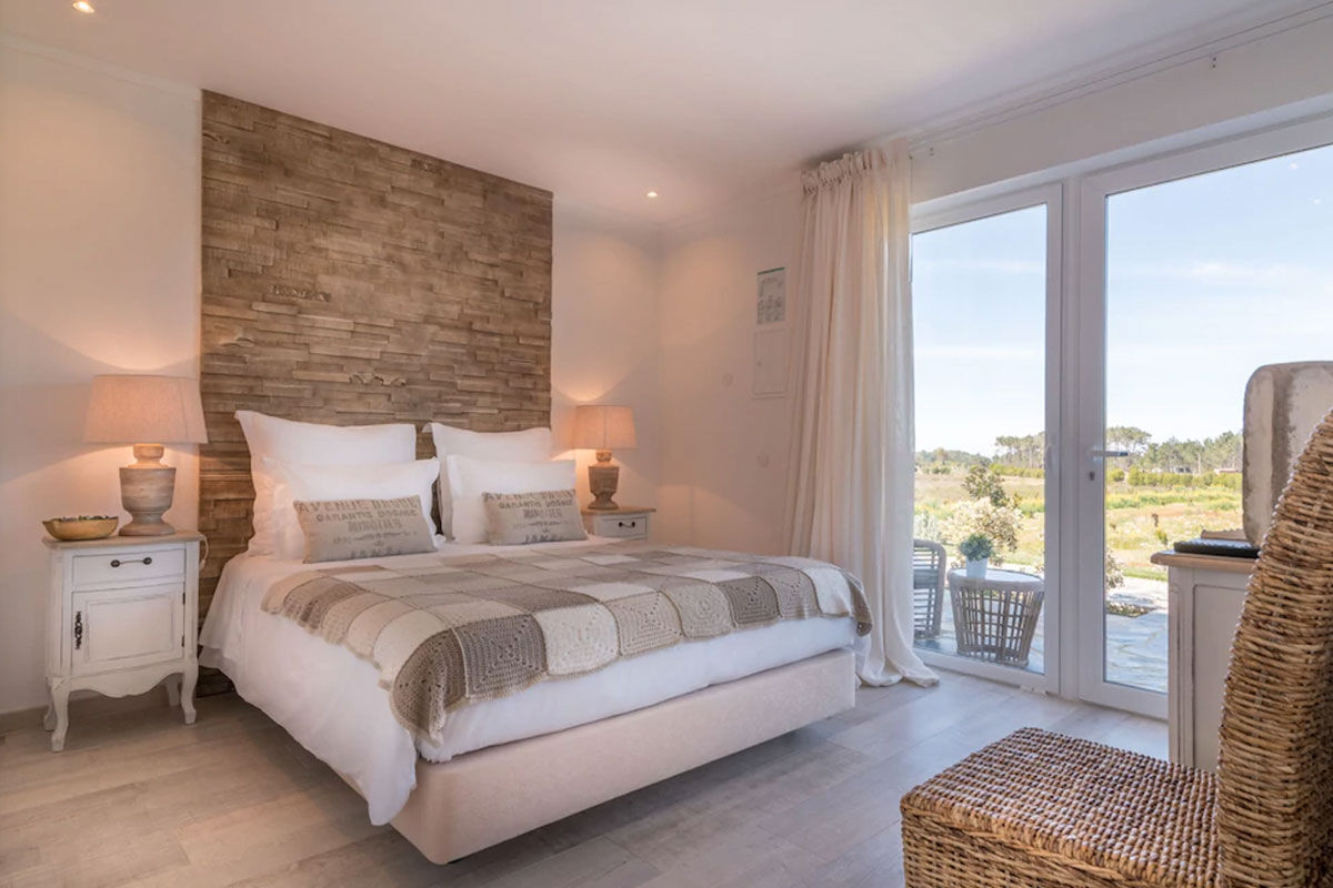 <b>Monte do Cardal, Odeceixe</b> - Cheery and bright, the Monte do Cardal is a boutique resort with pink hues and stripes pairing throughout. Lounge in the sun by the pool or admire the garden while sipping a refreshing drink before retreating to your county-chic room for a good night’s rest.