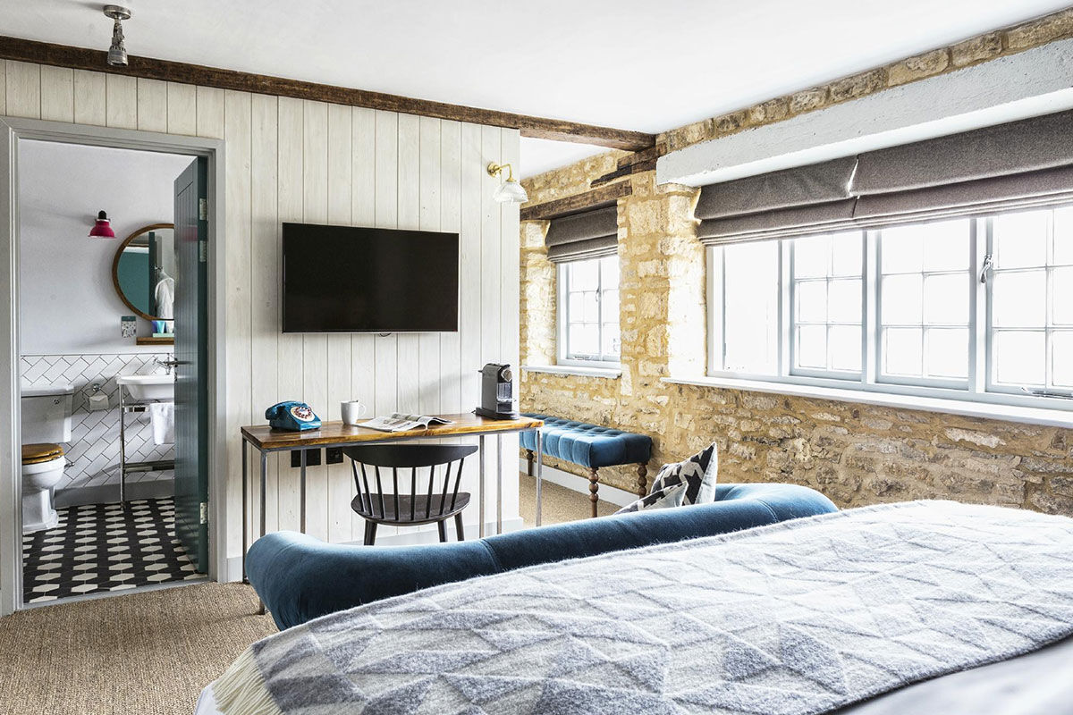 <b>The Old Stocks Inn, Stow-on-the-Wold</b> - This 17th century coaching inn set in Stow-on-the-Wold’s historic market square has been refurbished into a boutique hotel with character and charisma. There’s a historic pub with exposed oak beams and a log fireplace along with an English patio garden and vibrant detailing.