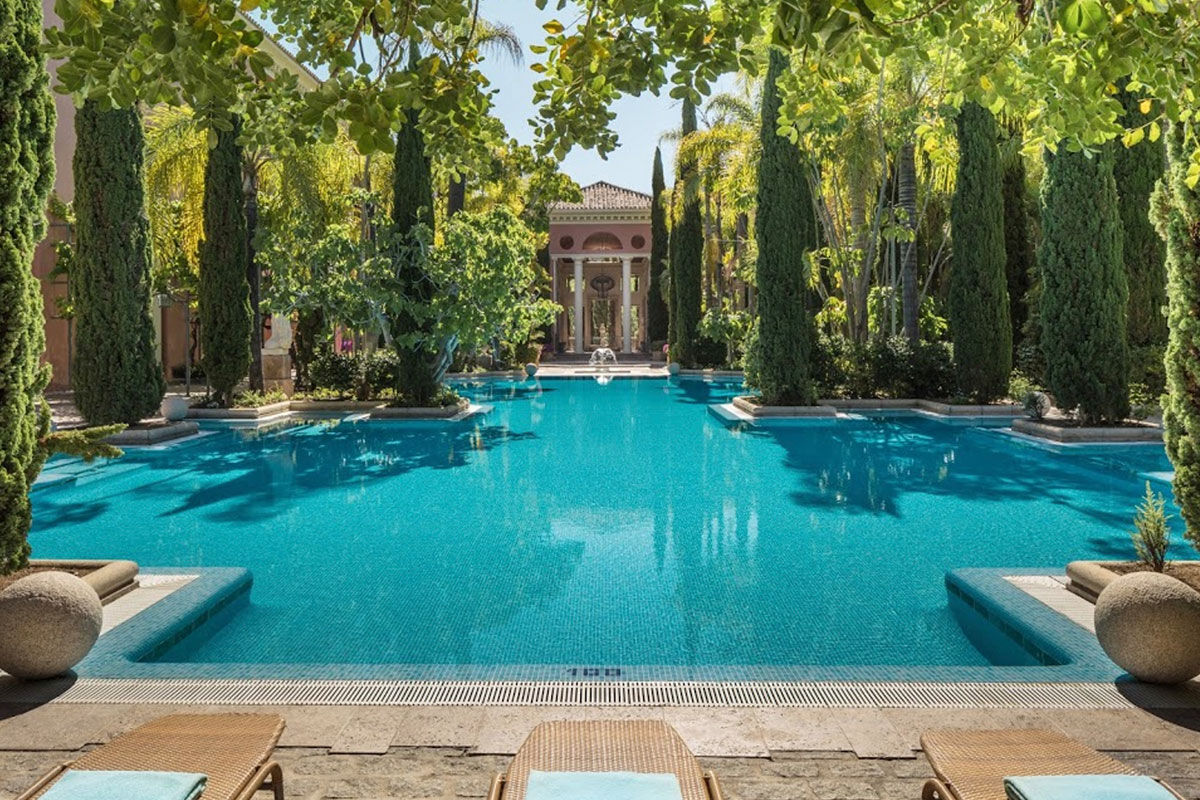 <b>Anantara Villa Padierna Palace Benahavís Marbella Resort</b> - Surrounded by gardens and with views of the Mediterranean Sea, this grand hotel is sophisticated, refined, and draws guests with its blush colored exterior. The property boasts 8 restaurants, 3 golf courses, indoor and outdoor pools, a beach club, and a posh spa.