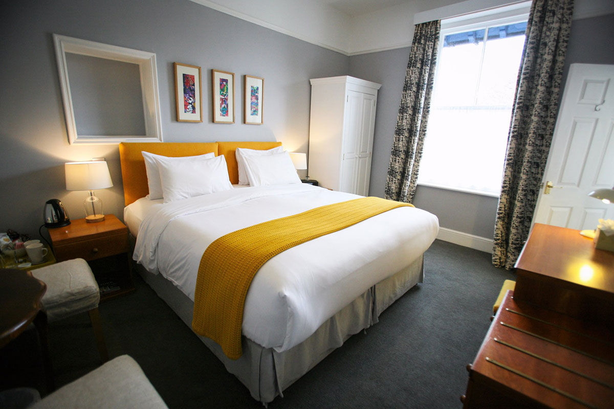 <b>The Parisi Hotel</b> - Only a 6-minute walk to The Shambles (a popular shopping street with timber-framed buildings), this converted rectory from the Victorian era is now a contemporary hotel overlooking the Church of St. Denys. With a library lounge and a garden with seating, this boutique hotel is cozy, bright and features colorful paintings throughout.