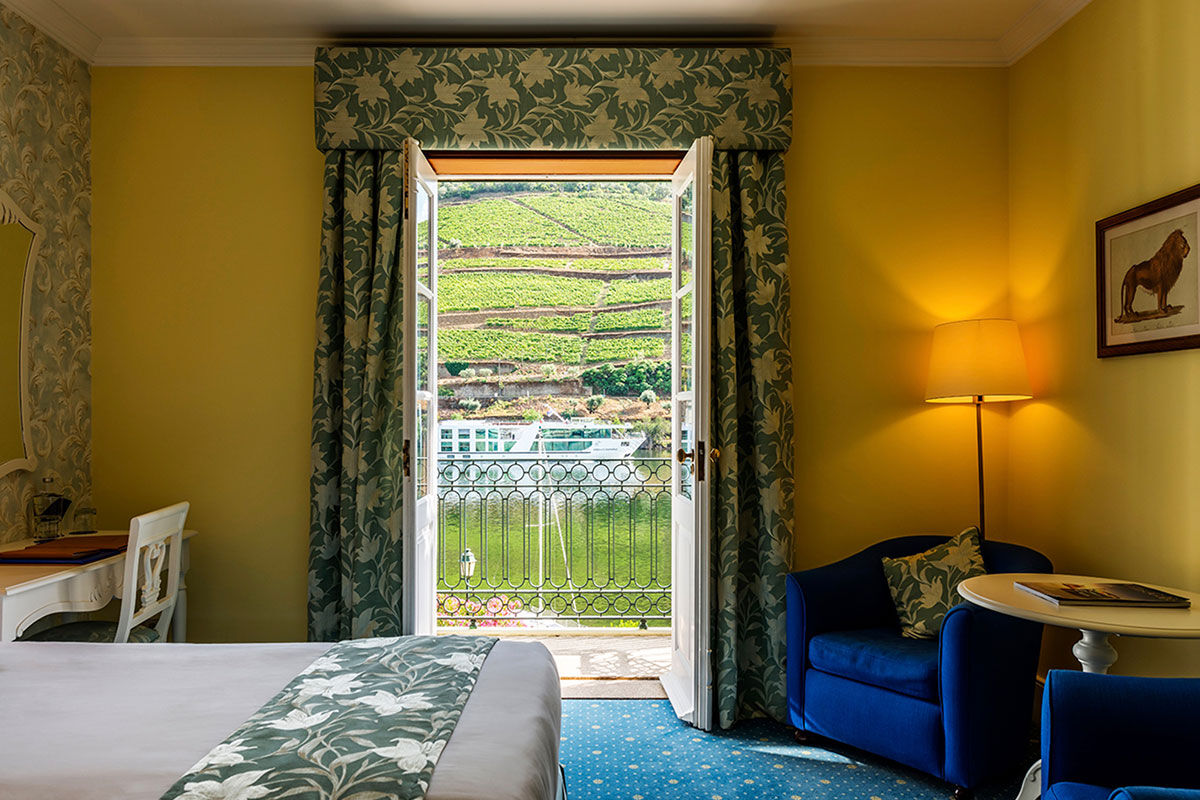 <b>The Vintage House Douro, Pinhao</b> - Before it was restored into an upscale retreat hotel, the Vintage House Douro was an old wine estate encircled by the tranquil hills of the Douro River Valley. It’s no surprise that this hotel pulls from its heritage and offers wine tasting sessions next to the fireplace in the cozy bar.