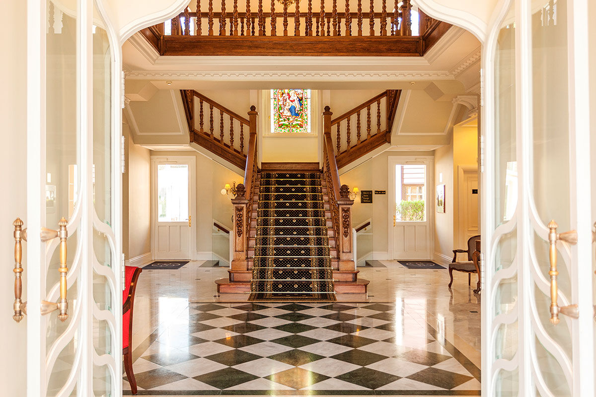 <b>Villa Soro, Donostia</b> - Close to Zurriola beach and San Sebastian Cathedral, Villa Soro occupies two buildings, one of which was built in 1898 and is a Historical Heritage Building of San Sebastian. In that building, the main hallway features a grand stairwell with a stained-glass window and marble floors; the rooms are refined with much natural light. The property boasts a wood-paneled bar and lounge.