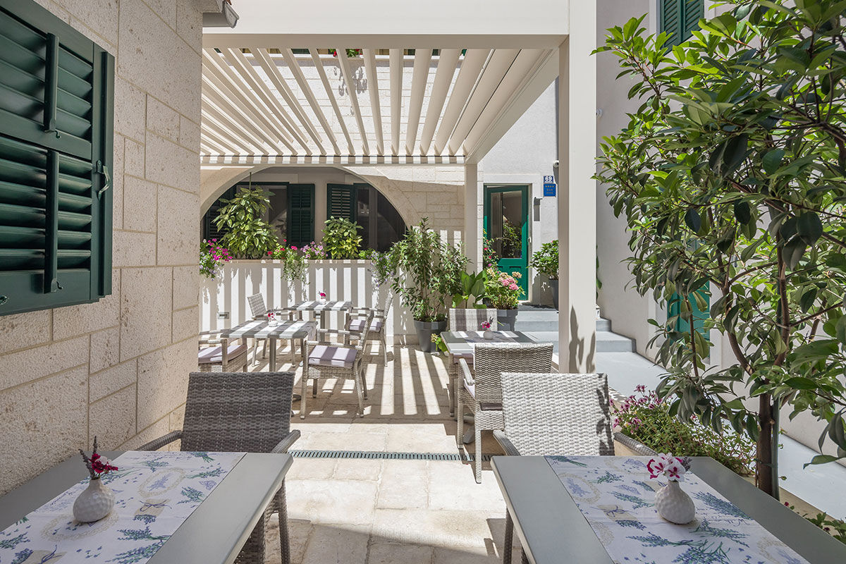 <b>Balatura Split Luxury Rooms</b> - Tucked in a quiet neighborhood by the port, this quaint B&B is relaxed and easygoing. The rooms are fresh-feeling and the patio is a perfect place to start your morning in peace.