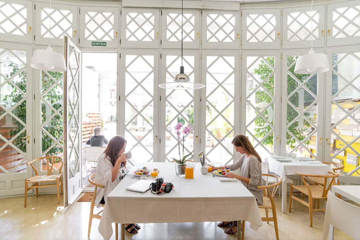 <b>Ca La Maria</b> - Featuring modern artwork, photographs and eclectic touches throughout, this boutique B&B is housed in an art-deco styled building that is only a 7-minute walk to Gaudi’s Casa Mila. The patio is full of leafy potted plants and has couches and umbrellas to relax under.