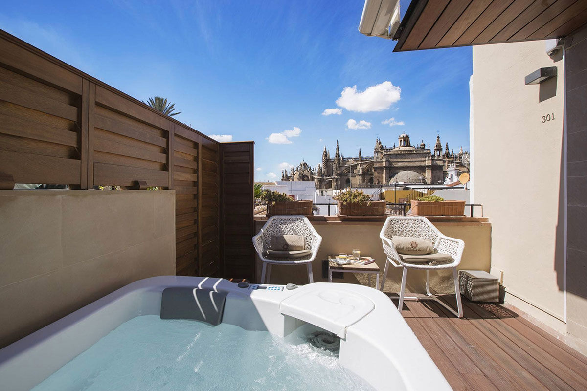 <b>Casa 1800 Sevilla</b> - Just a 2-minute walk from the Catedral de Sevilla, this 1864 mansion is ornate and sophisticated with a neutral toned palette. There’s a rooftop terrace with panoramic city views as well as a complimentary afternoon tea for guests to enjoy.