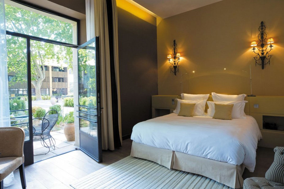 <b>Domaine de Manville, Les Beaux de Provence</b> - Wander around the stone fountain after enjoying a formal meal on the outdoor terrace, soak in the pool surrounded by lush shrubbery, or head to the eco-responsible golf course for a couple of rounds. The Domaine de Manville is a genteel hotel that offers guests a relaxing escape on its 100-acre estate.