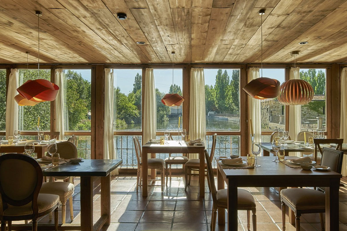 <b>Hacienda Zorita, Salamanca</b> - What once was an ancient Dominican monastery of the 14th century, Hacienda Zorita is a wine hotel and organic farm located on the River Tormes and is surrounded by countryside and vineyards. Taste the small batch wines, savor local cuisine, and admire the exposed wooden beams, stone walls, and almost-Tuscan finishes.