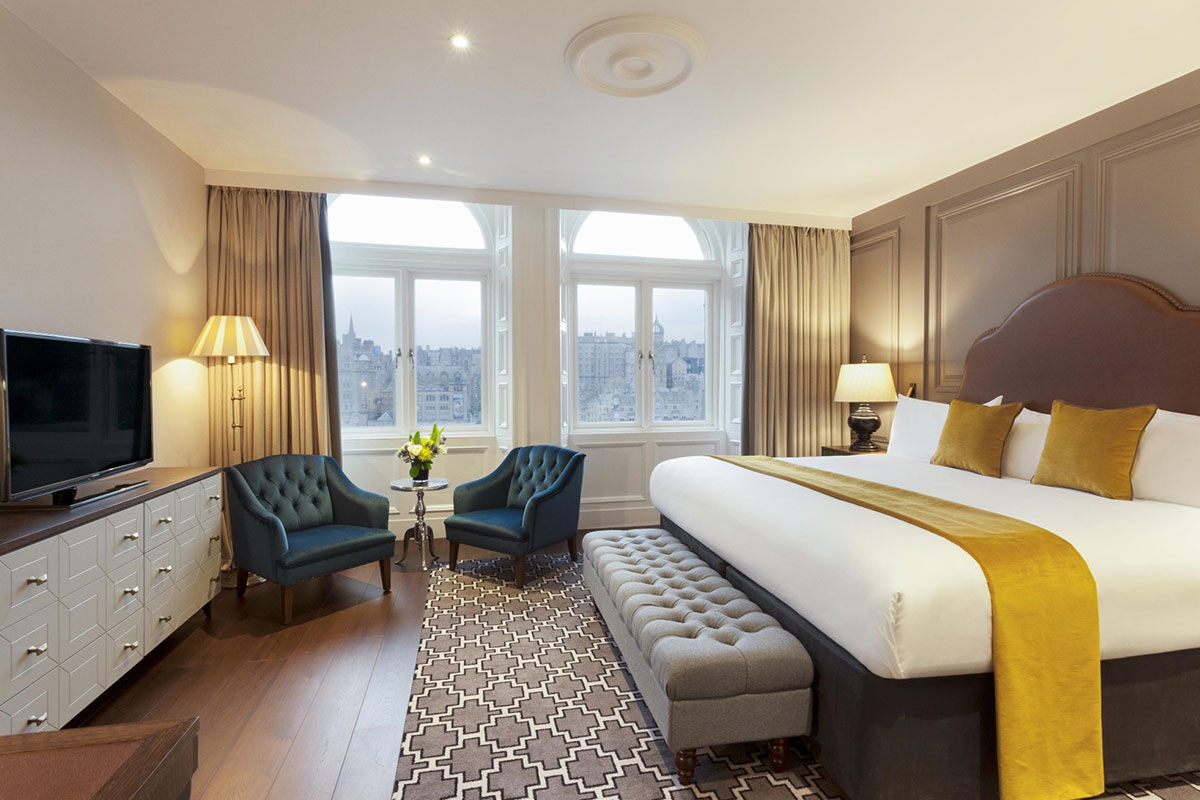 <b>Hotel Indigo Princes Street</b> - Close to museums and castles, this genteel hotel features dark wood, leather and aged photographs throughout, making you feel like you stepped into a moody upscale pub for a delicate cocktail. With tufted furnishings and modern touches, the Hotel Indigo Princes Street is the perfect match of traditional period pieces and contemporary details.