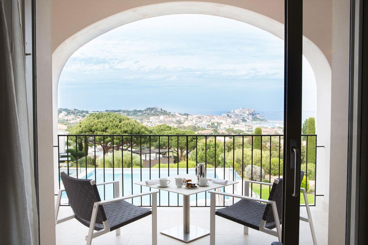 <b>La Villa Calvi, Calvi</b> - Nestled on the heights of Calvi, this elegant hotel is a retreat with a view. With five pools, two fine dining restaurants and a poolside bar, this classically modern hotel awaits its guests with open arms.