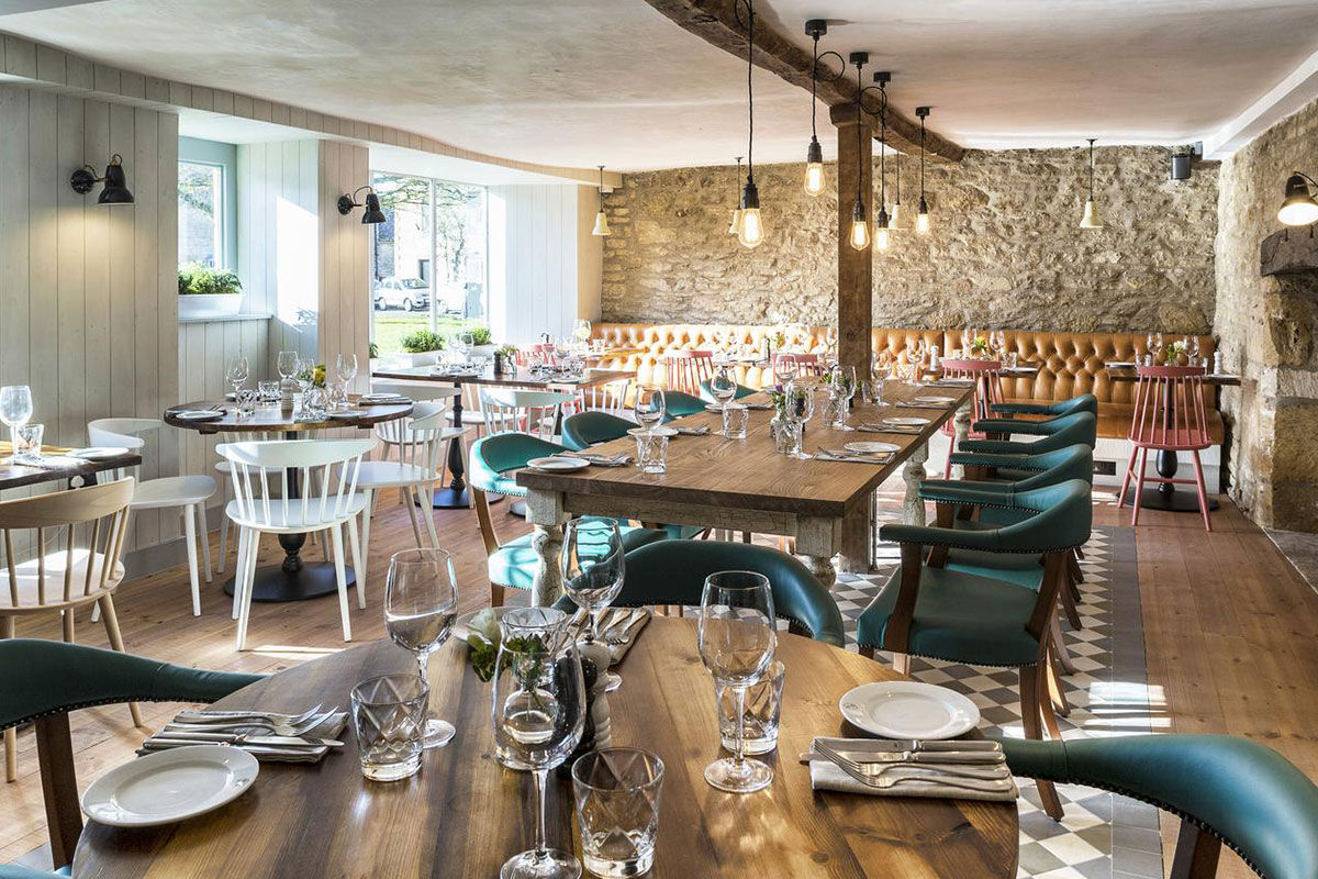 <b>The Old Stocks Inn, Stow-on-the-Wold</b> - This 17th century coaching inn set in Stow-on-the-Wold’s historic market square has been refurbished into a boutique hotel with character and charisma. There’s a historic pub with exposed oak beams and a log fireplace along with an English patio garden and vibrant detailing.