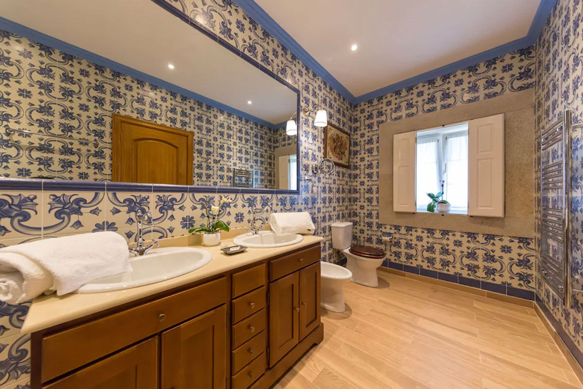 <b>Casa de Sao Domingos, Peso da Regua</b> - This quaint B&B gets its charm from the plants growing in terracotta pots, its stone wall next to the pool, and the sun loungers with parasols. The views of the Duoro River with hills in the background makes for a perfect backdrop for your relaxing vacation.