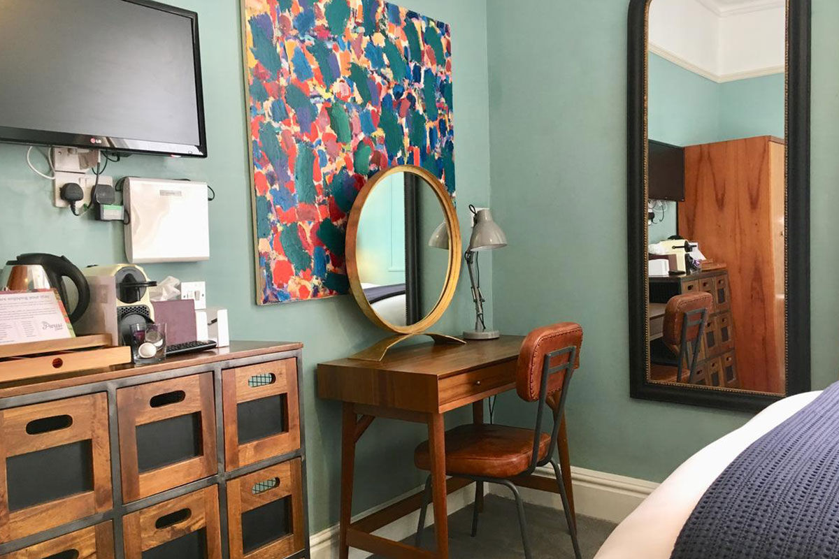 <b>The Parisi Hotel</b> - Only a 6-minute walk to The Shambles (a popular shopping street with timber-framed buildings), this converted rectory from the Victorian era is now a contemporary hotel overlooking the Church of St. Denys. With a library lounge and a garden with seating, this boutique hotel is cozy, bright and features colorful paintings throughout.