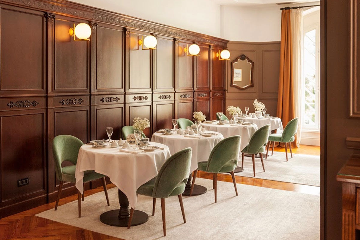 <b>Villa Soro, Donostia</b> - Close to Zurriola beach and San Sebastian Cathedral, Villa Soro occupies two buildings, one of which was built in 1898 and is a Historical Heritage Building of San Sebastian. In that building, the main hallway features a grand stairwell with a stained-glass window and marble floors; the rooms are refined with much natural light. The property boasts a wood-paneled bar and lounge.