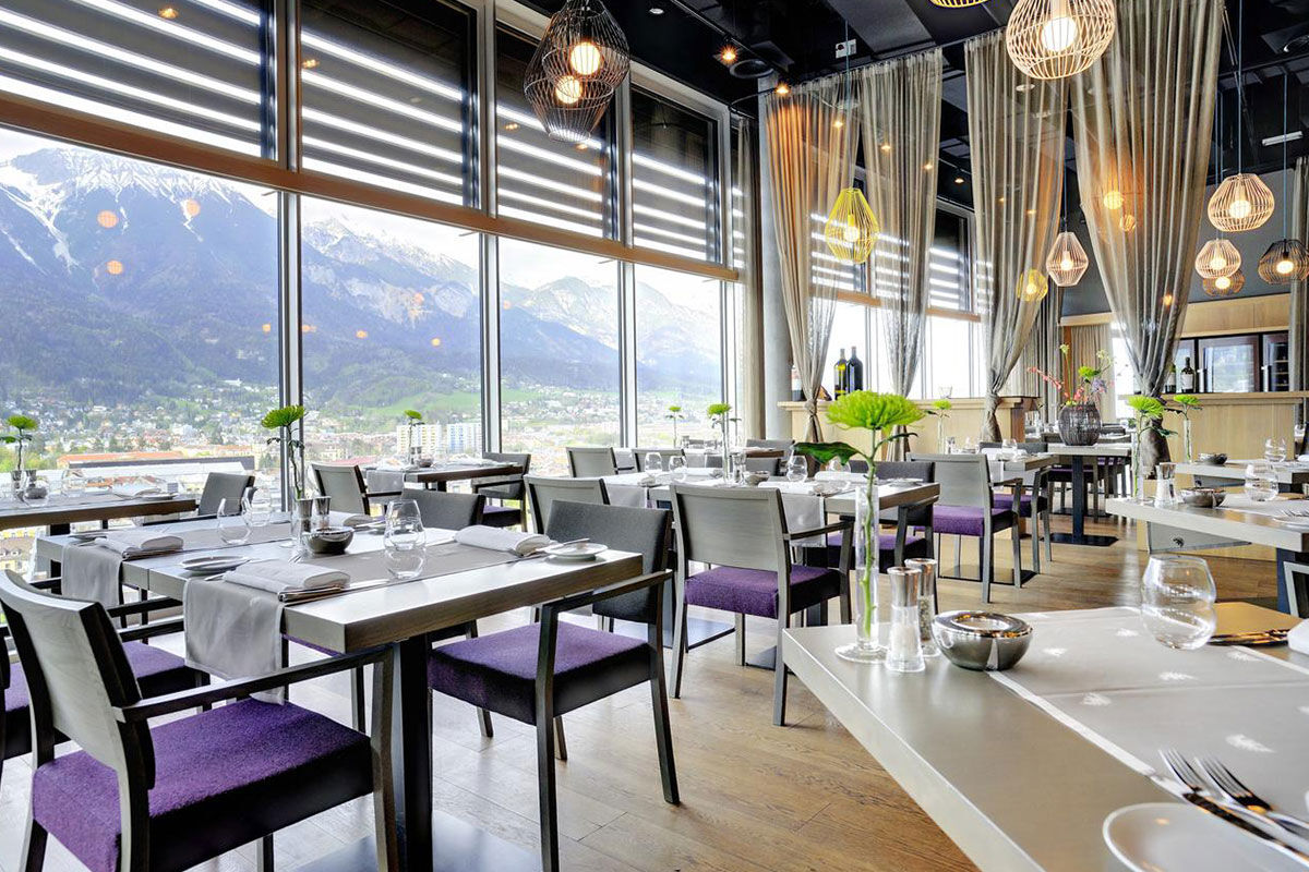 <b>Adlers Hotel Innsbruck</b> - Enjoy panoramic views of the city and Tyrolean Alps from this alpine-urban styled hotel in downtown Innsbruck. With newly designed rooms, a Turkish steam bath and sleek rooftop terrace, guests are rejuvenated to venture out and explore.