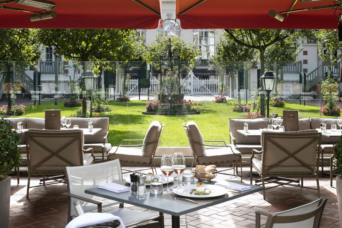 <b>Hotel Barrière Le Normandy</b> - With an air of Old-World elegance, this stately hotel is close to the Plage Deauville beach, Casino de Villers sur Mer and offers free loaner bikes for guests. Along with an indoor pool, tennis courts, and classically styled rooms, the Hotel Barriere Le Normandy also features a handsome bar with wood paneling and an elegant seafood restaurant with stained-glass windows.