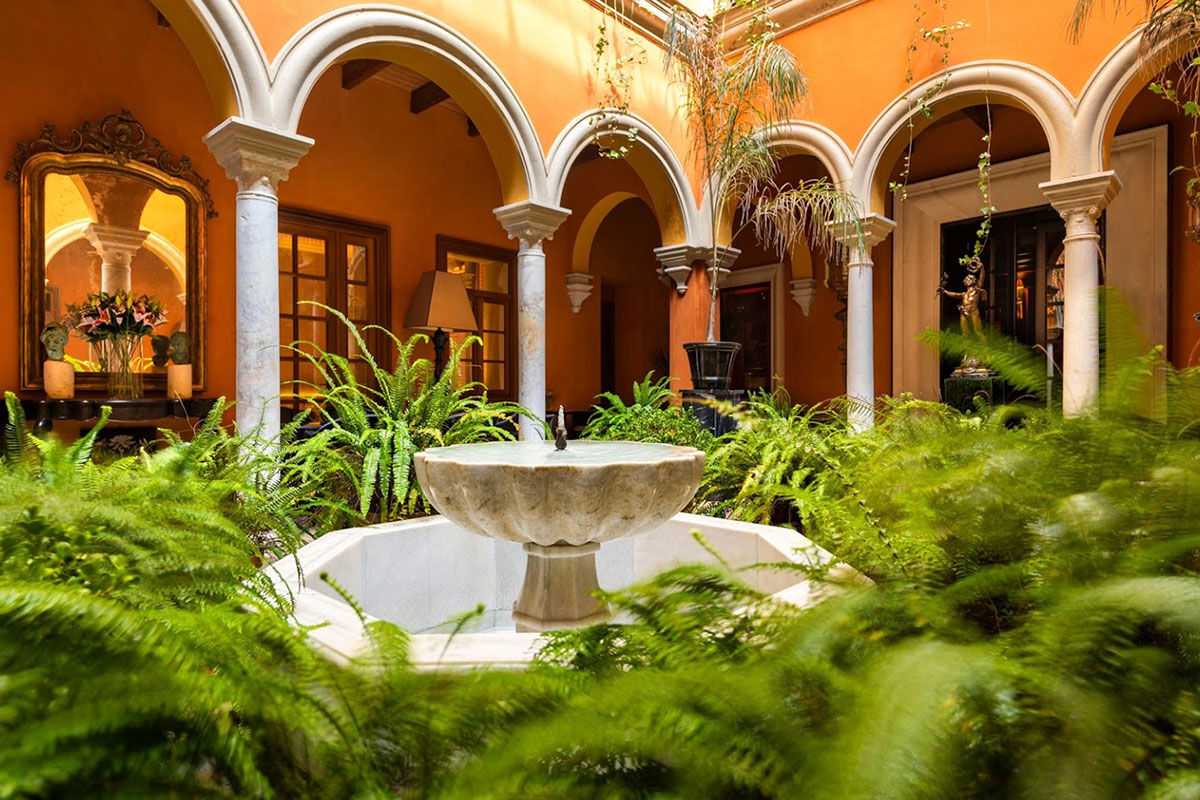 <b>Boutique Hotel Casa del Poeta</b> - With a warm orange courtyard, full of lush greenery, this historic mansion is a 3-minute walk to the Seville Cathedral and a 7-minute walk to the Alcazar of Seville. Rooms are classically elegant and the fountain in the center of the courtyard is guests’ favorite detail.
