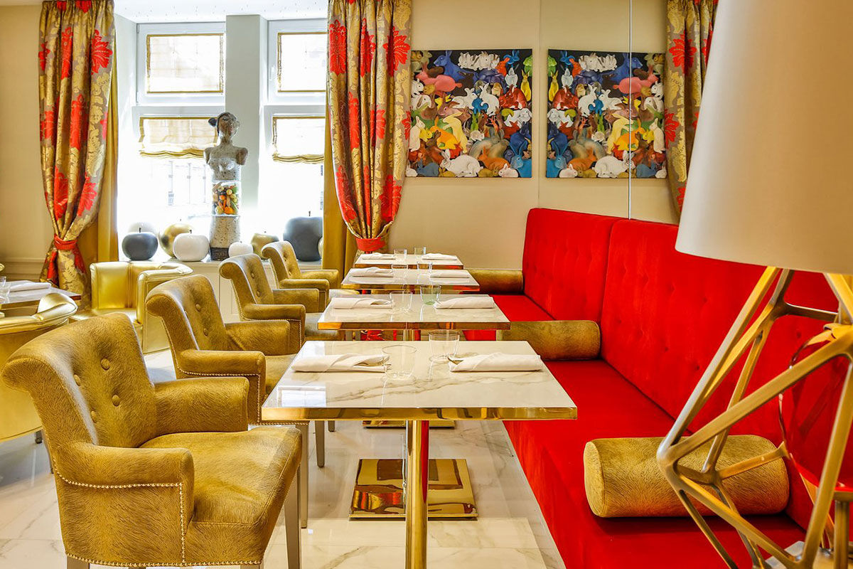 <b>Hotel Das Tyrol</b> - Shimmering gold and red velvet chairs reign at the Hotel Das Tyrol, along with original artworks by contemporary artists. This mod-chic hotel features a gold-tiled spa with a sauna and is a 13-minute stroll to the Hofburg Imperial Palace.