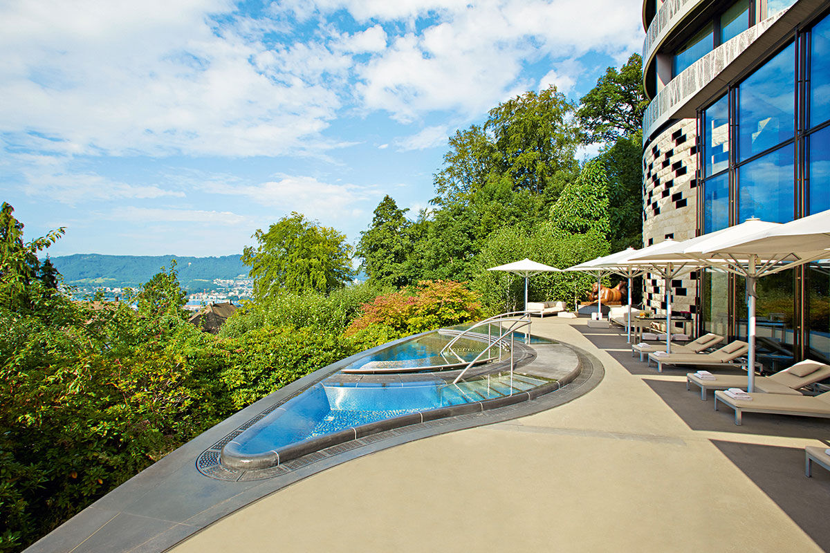 <b>The Dolder Grand</b> - A castle in the sky, this contemporary art hotel is housed in a stately building est.1899 and has views of the Alps and Lake Zurich. Enter this fairytale-like hotel and find a two Michelin starred restaurant, a comprehensive spa, panoramic pool, as well as a lounge/bar with live piano music.