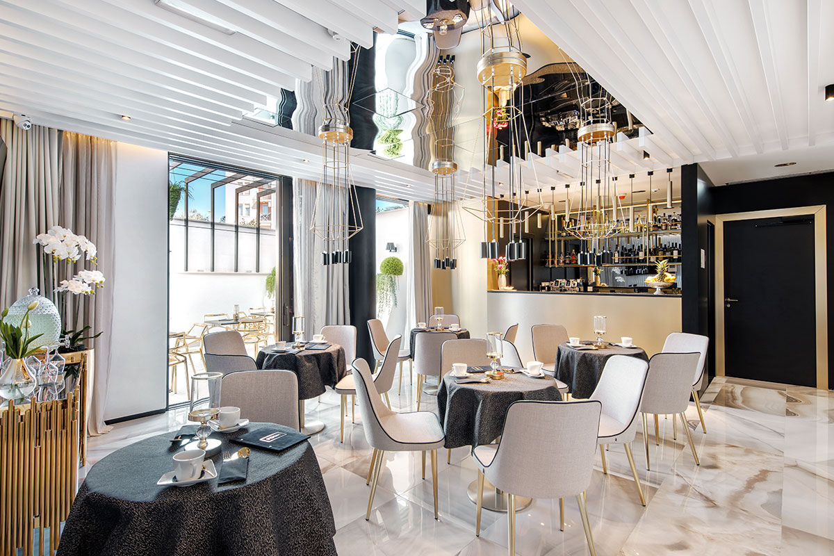 <b>All Suites Hotel Posh</b> - It’s all in the name. With details like palms potted in giant head sculptures, feathery pool umbrellas and geometric furniture, the Hotel Posh is luxe, eclectic and design-forward. The rooms and common areas are streamlined and glamorous, the dining room features gold fixtures and the pool is situated for colorful sunset views.