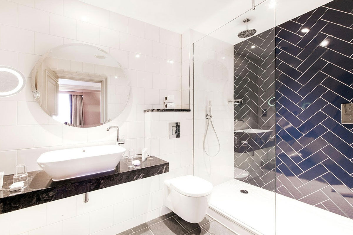 <b>Hotel Indigo Princes Street</b> - Close to museums and castles, this genteel hotel features dark wood, leather and aged photographs throughout, making you feel like you stepped into a moody upscale pub for a delicate cocktail. With tufted furnishings and modern touches, the Hotel Indigo Princes Street is the perfect match of traditional period pieces and contemporary details.