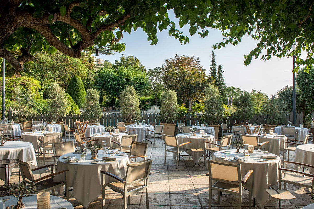 <b>Hotel Baumaniere, Les Baux de Provence</b> - With a 2-Michelin star restaurant, spa with hammam, tennis court, lounge-bar, pool and bike rental on site, the Baumaniere is full of activity. The rooms are modern, yet Provencal, the gardens and ponds are charming, and the boutique sells local products to savor.