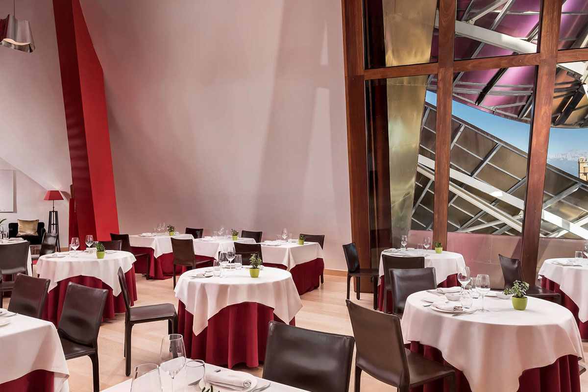 <b>Hotel Marques de Riscal, Elciego</b> - Designed by architect Frank Gehry, the Hotel Marques de Riscal is a piece of artwork in and of itself and has incredible views over the vineyard. Nestled within the medieval village of Elciego, the spectacular curves, titanium roof and avant garde feel is surprising within the region, to say the least!